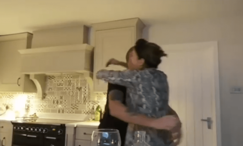  Jamie's parents celebrate in their kitchen at home