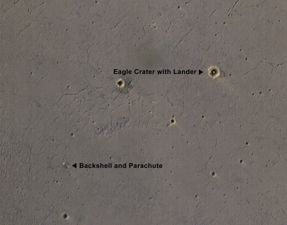 This image captures the landing site and parachute of the 2004 rover Opportunity