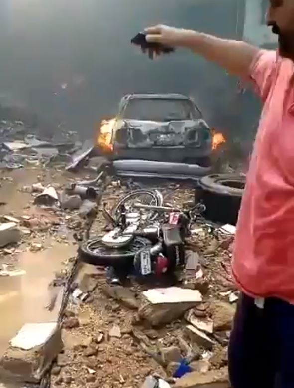  A burnt out car is pictured at the scene of the horrific crash near Karachi Airport