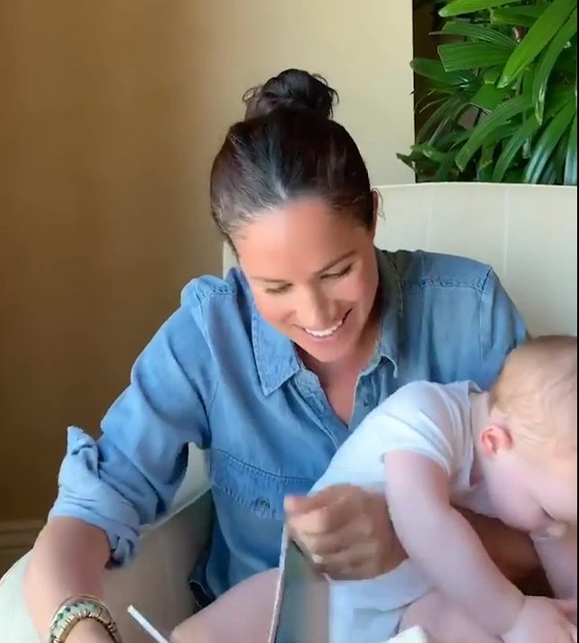  Meghan appeared to have her hands full as little Archie got distracted