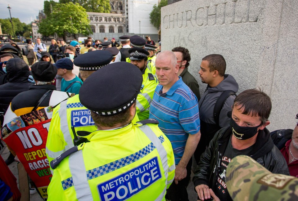 People defend the Churchill monument during Black Lives Matter protests