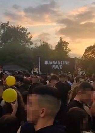 Thousands flocked to the illegal event advertised with on a sign as a 'quarantine rave'