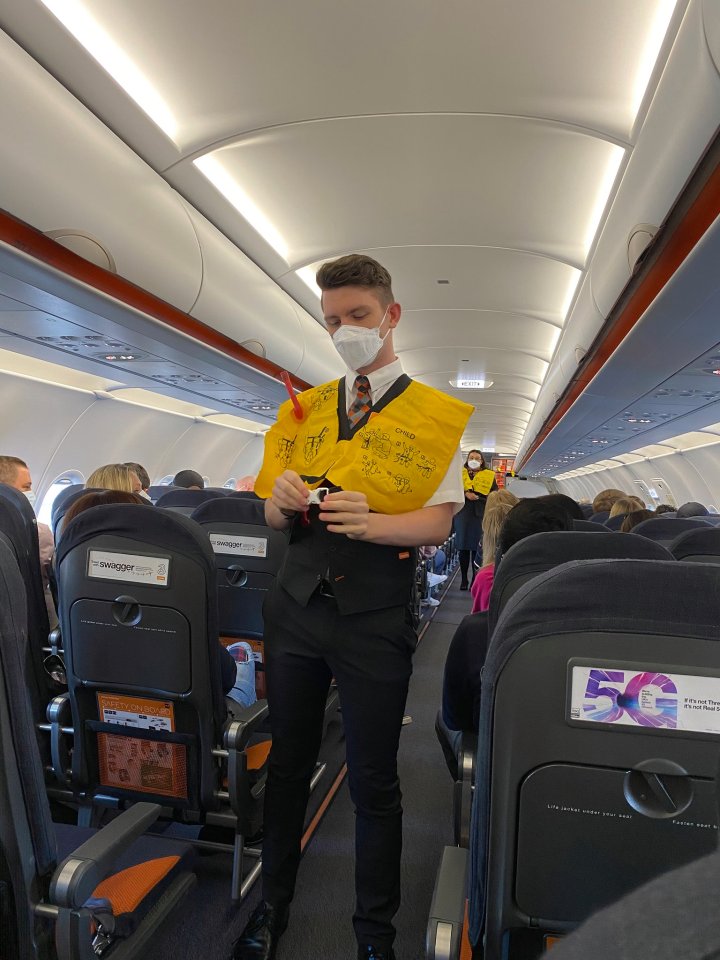 The crew rattle through the standard safety briefing, but of course when describing how to use the oxygen masks, there’s an extra reminder to remove your face mask before putting it on