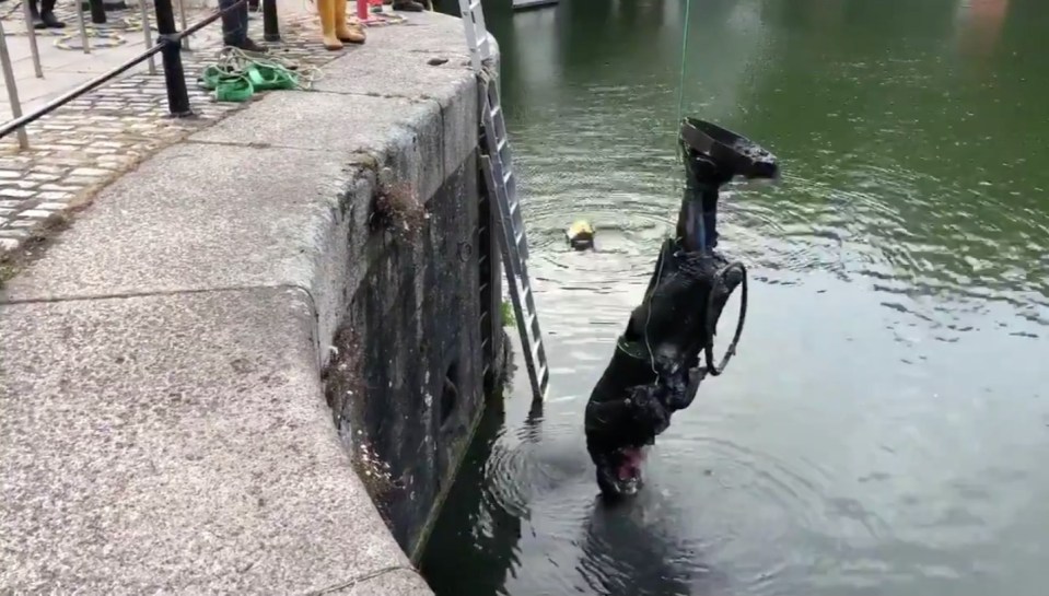 The statue of Edward Colston is hauled from the Bristol harbour after being bumped there by Black Lives Matter protestors