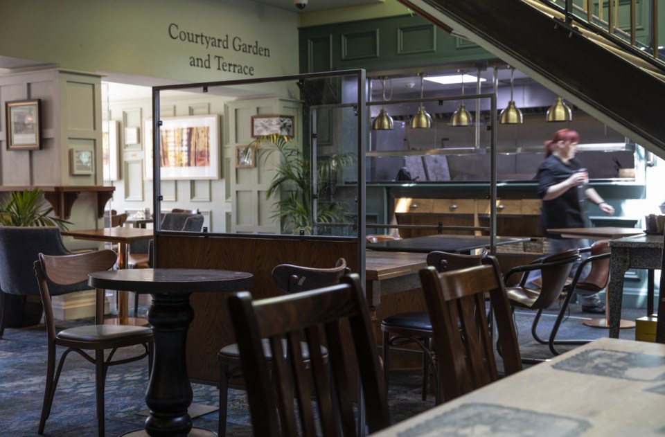 Perspex screens have been put up between tables to keep households separate 