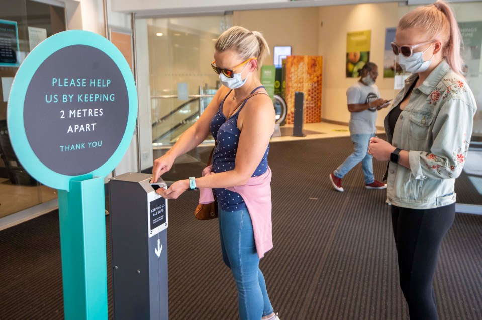 Customers entering the store are encouraged to sanitise their hands