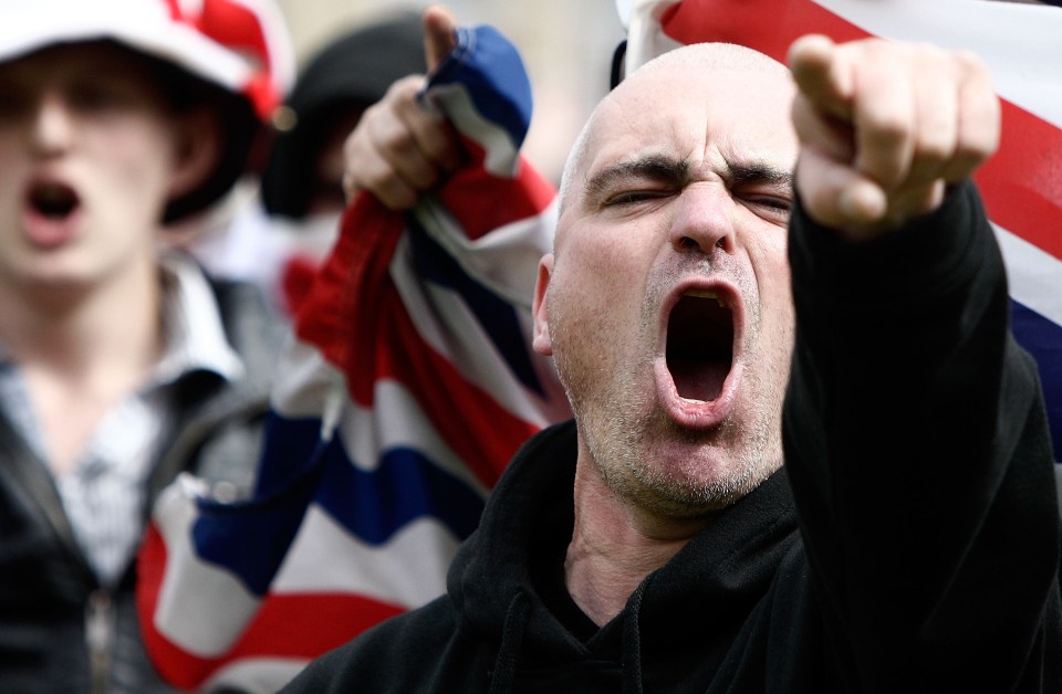 English Defence League supporters chant during a demonstration in Bradford in 2010