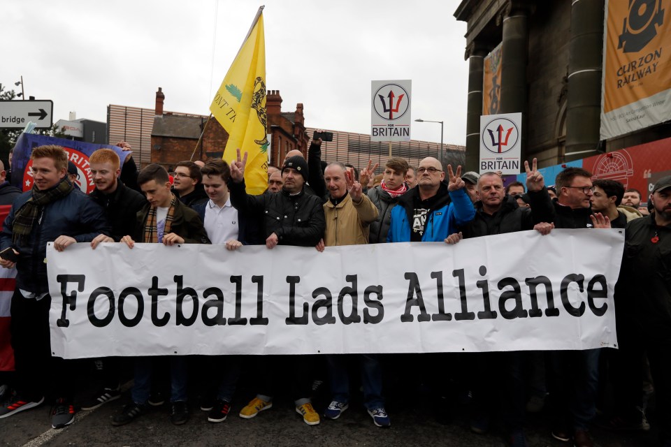 People take part in a Football Lads Alliance (FLA) march in Birmingham in March 2018