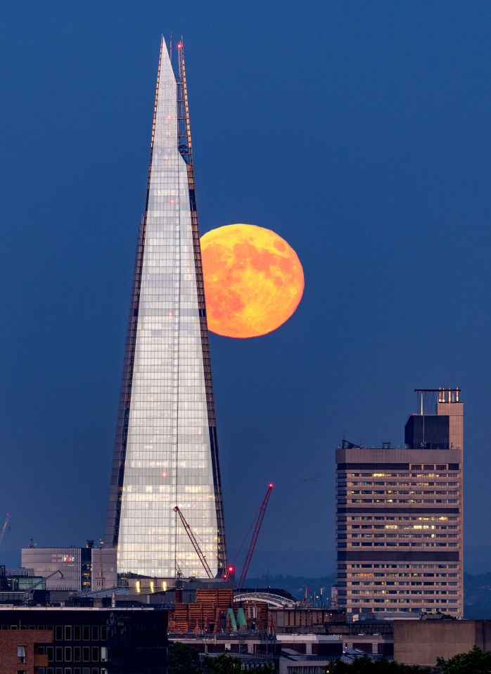 A Strawberry Moon near London's Shard building