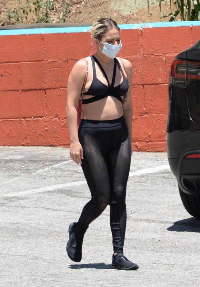  Lady Gaga wears a strappy cropped top and leggings for a stroll with boyfriend Michale Polansky