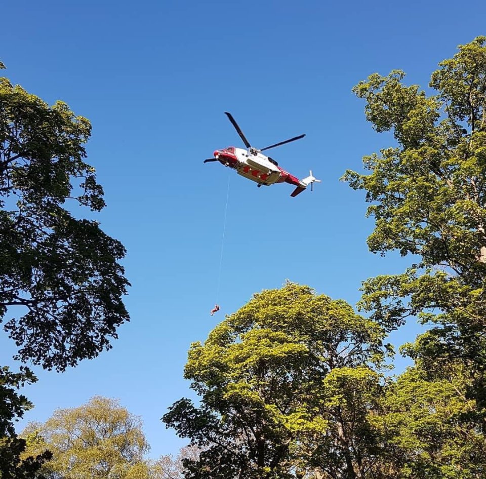 The man was airlifted to hospital with spinal injuries after a four-hour wait