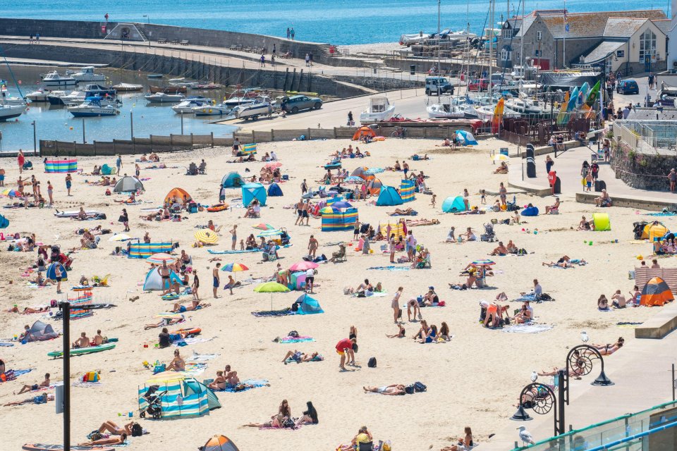 Summer is a time for some sunny weather with people flocking to beaches, like this one in Lyme Regis