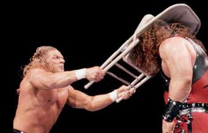 Triple H has been fined for delivering chair shots to the head after they were outlawed by his father-in-law Vince