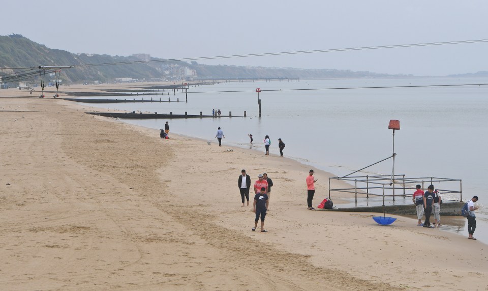  Bournemouth beach was heaving on Tuesday - but the crowds cleared as temperatures dropped on Wednesday