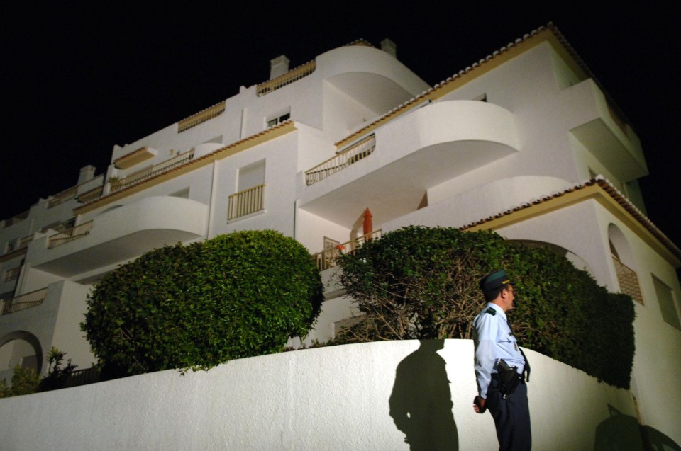 A police officer outside the Ocean Club apartment where Madeleine vanished in 2007