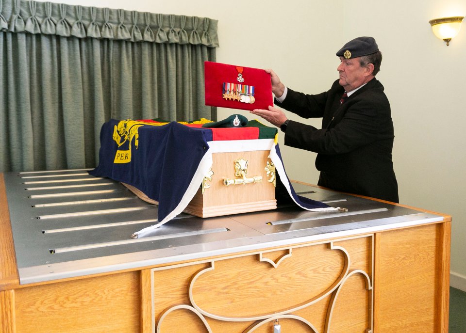  His medals were placed on his coffin as mourners paid their respects to the D Day veteran