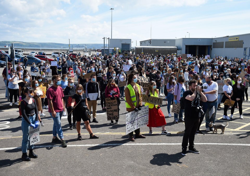  Demonstrators march along the seafront in Dorset