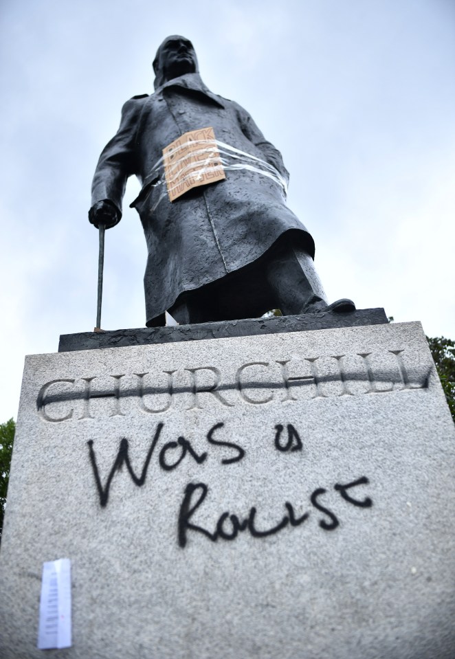  Protesters sprayed these words across the bottom of the Churchill statue.