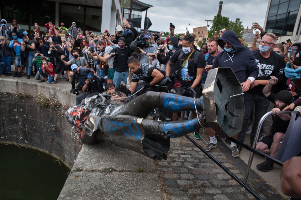  An Edward Colston statue is thrown off a bridge by protesters in Bristol