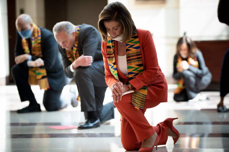  Speaker of the House Nancy Pelosi and other Democratic lawmakers take a knee