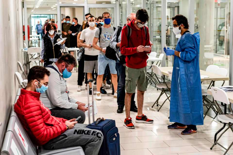 Some of the first travellers arrive in Larnaca, Cyprus, after the country reopened its airports on June 9