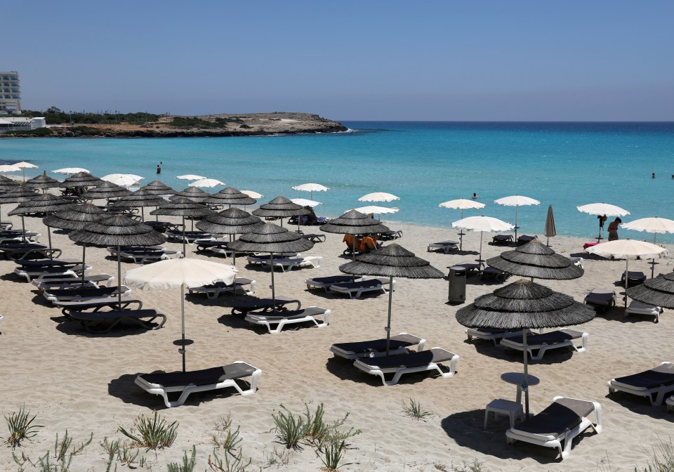 Empty sunbeds are seen at Nissi Beach in the resort of Ayia Napa on June 9