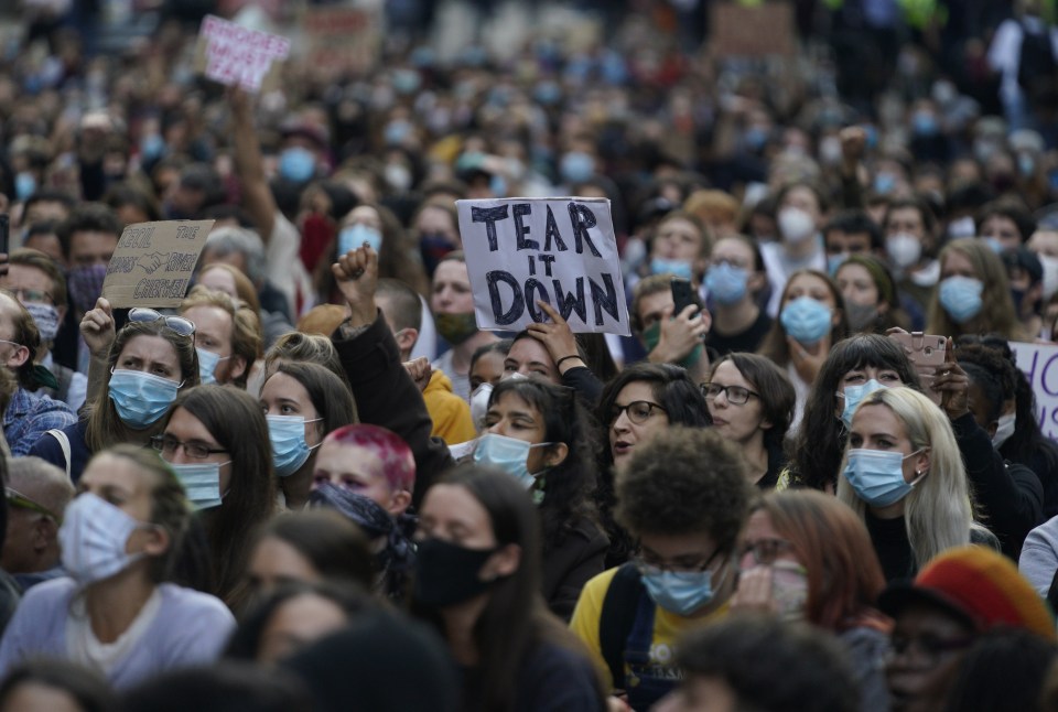 Protesters gather in front of Oriel College during a demonstration of the 'Rhodes Must Fall' campaign