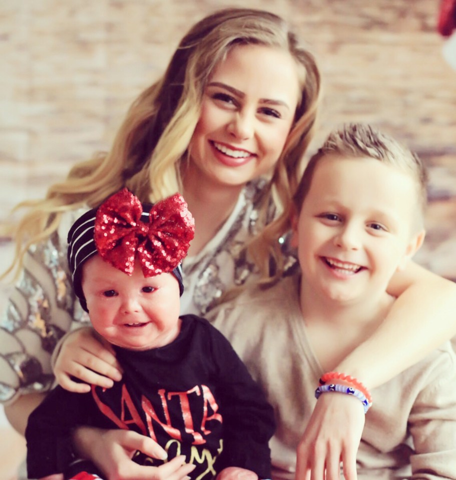 Little Harper is pictured above with her mum Angie and brother Jaxon