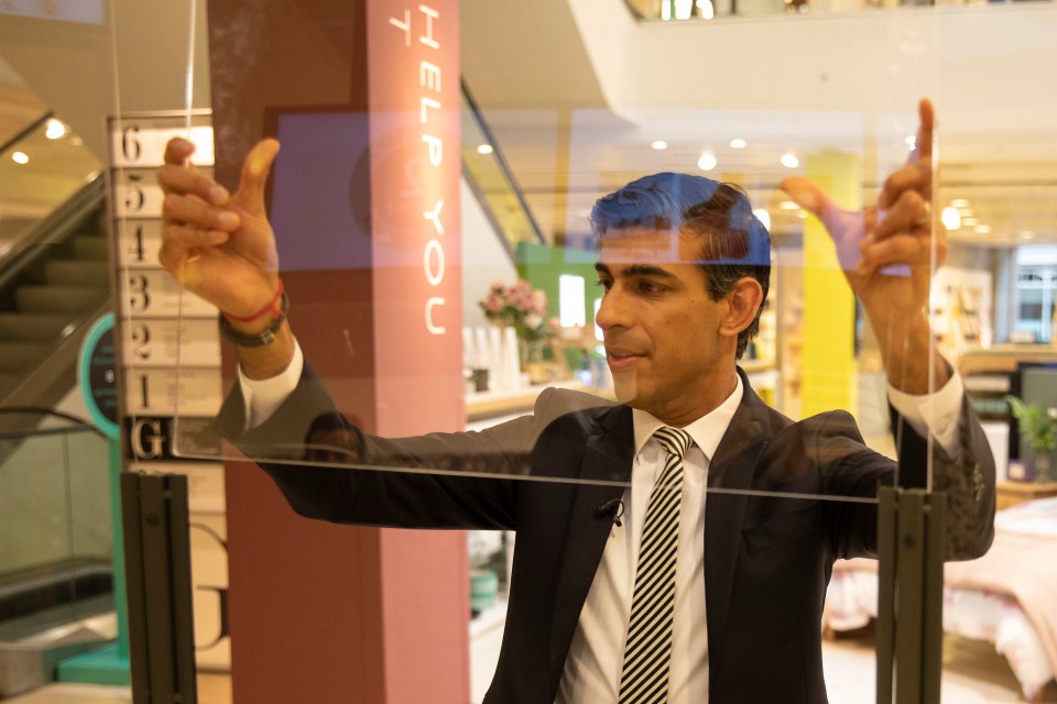 The Chancellor yesterday helped put up safety measures in John Lewis ahead of shops reopening next week