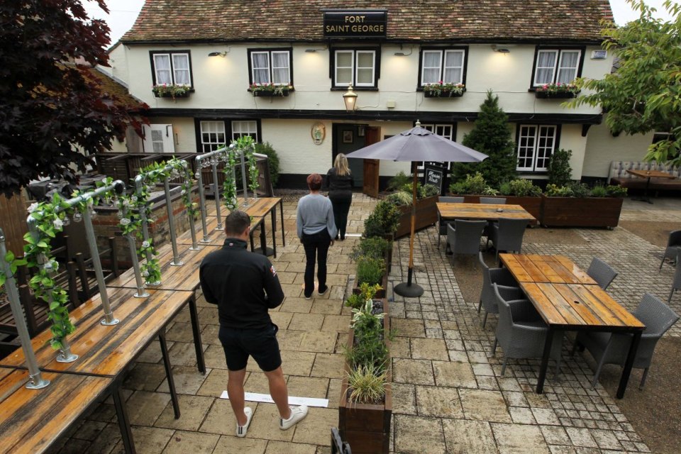 Punters will have to social distance before being allowed in, as shown at a Greene King pub 