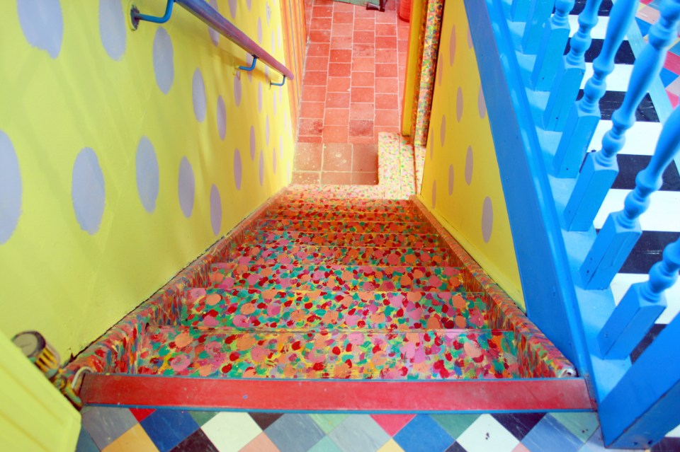 The home also has bright spotty stairs with blue railings