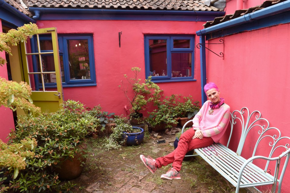 The courtyard has been turned into a bright pink pottery studio