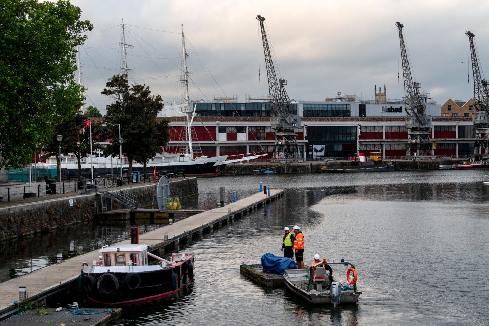 The decision was made to pull the statue out of the water early in the morning to avoid crowds