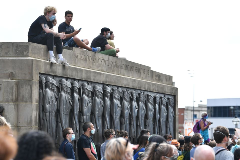 Liverpudlian protesters climbed onto the city's cenotaph 