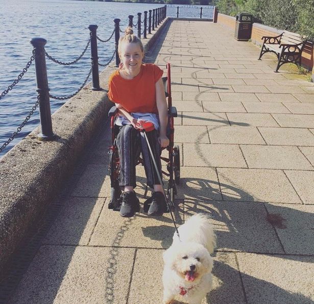 Gemma is unable to get around without her wheelchair, she is pictured with her dog 