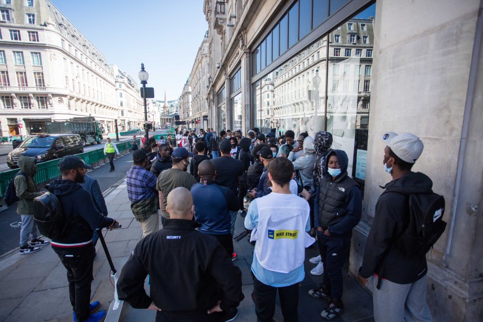 Shoppers waiting outside Niketown in Oxford Circus