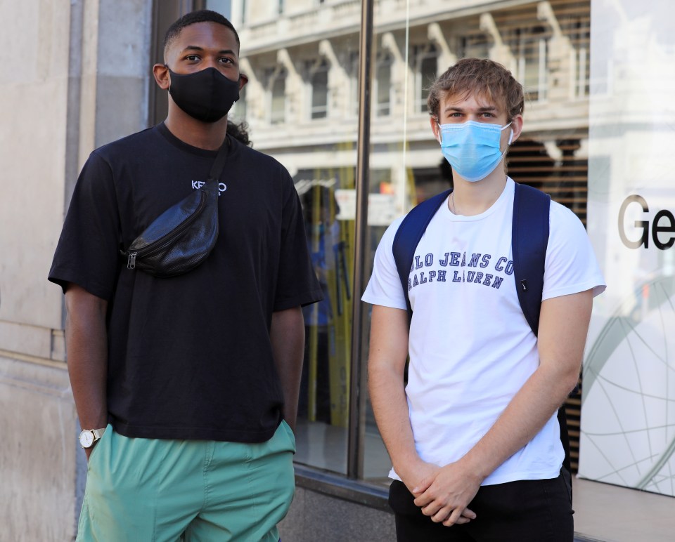  Shoppers Liam Shorter and Michael Barton wait patiently outside Oxford Street's Nike store