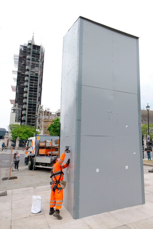 Workers started removing the protective metal panels from statues in central London