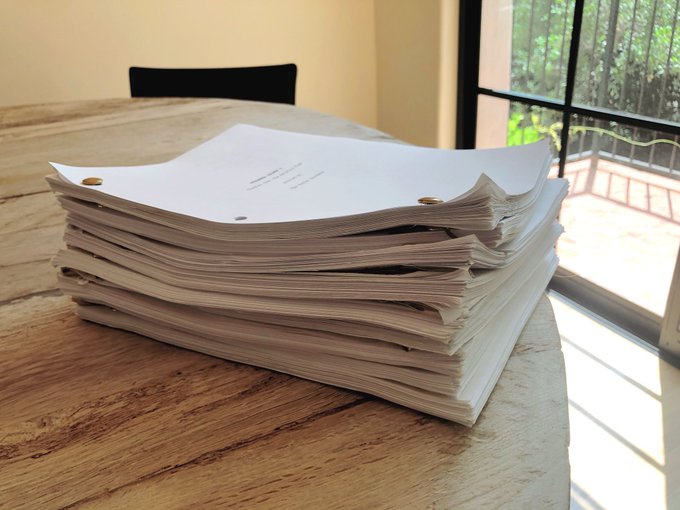  The writers shared a snap of a pile of scripts on a table