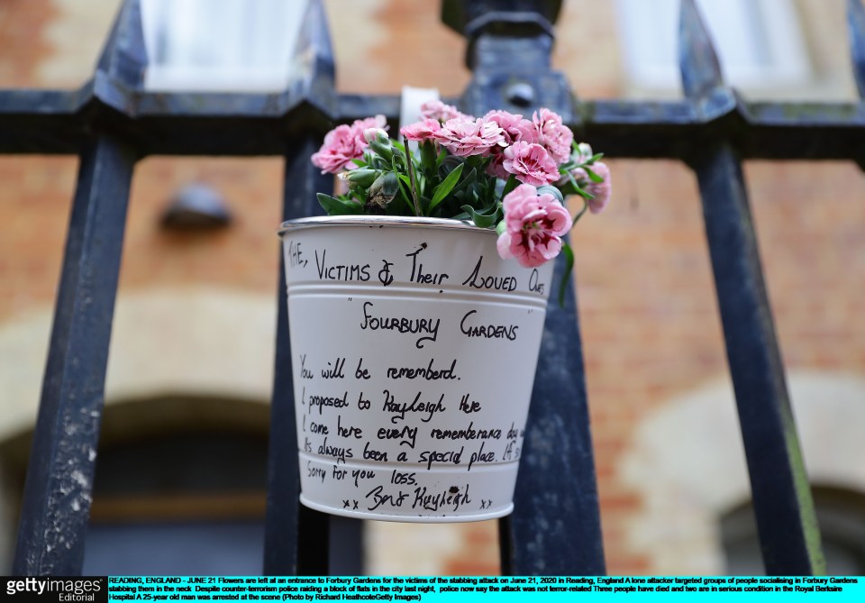  Flowers are left at an entrance to Forbury Gardens for the victims of the stabbing attack