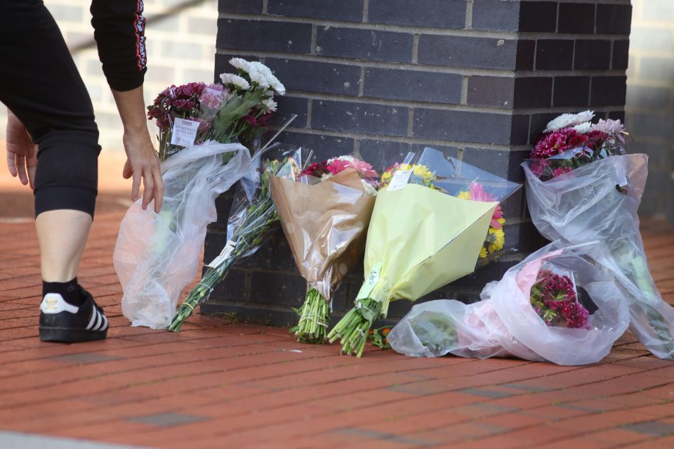 Floral tributes to the three people stabbed to death were being left close to Forbury Gardens this morning