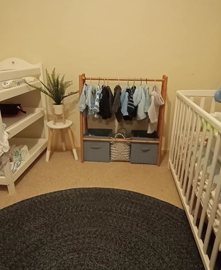 It fits perfectly in to nursery between the cot and change table 