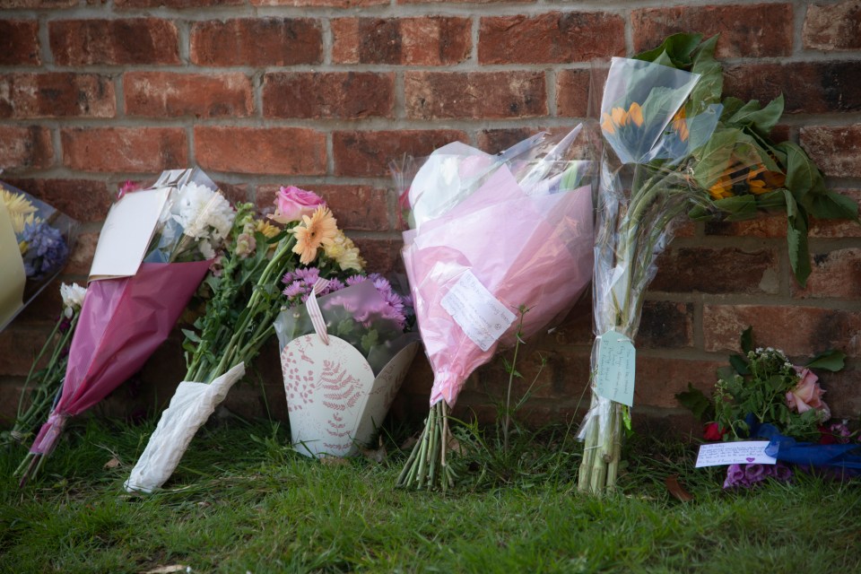 Flowers were left outside the Holt School in memory of Mr Furlong