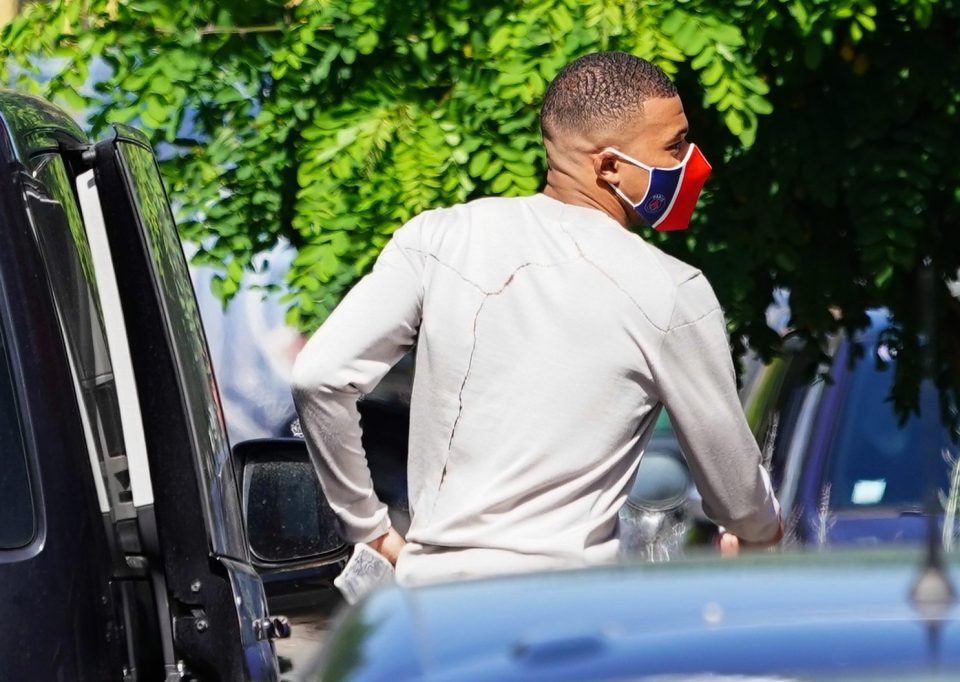 Kylian Mbappe went with a long-sleeve jumper to complete the look alongside his fresh fade