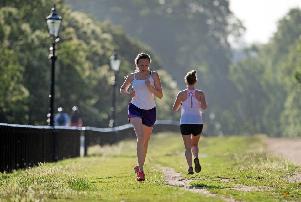 Early morning joggers making the most of the weather in Hyde Park, London