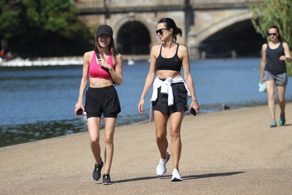 Two women on a morning walk along the Thames in the capital