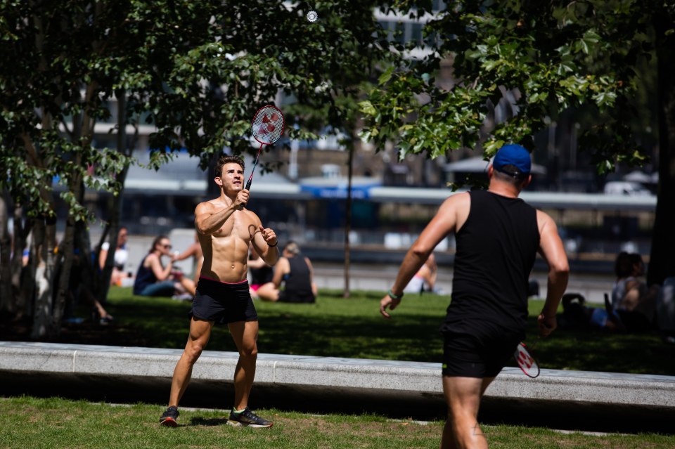 Two men play badminton at Potters Field in London