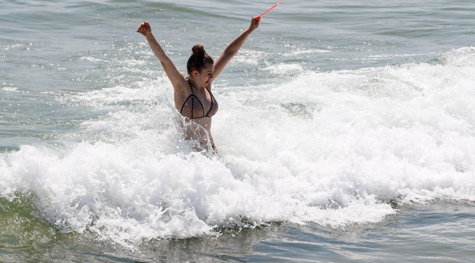 A swimmer enjoys the waves at Bournemouth beach