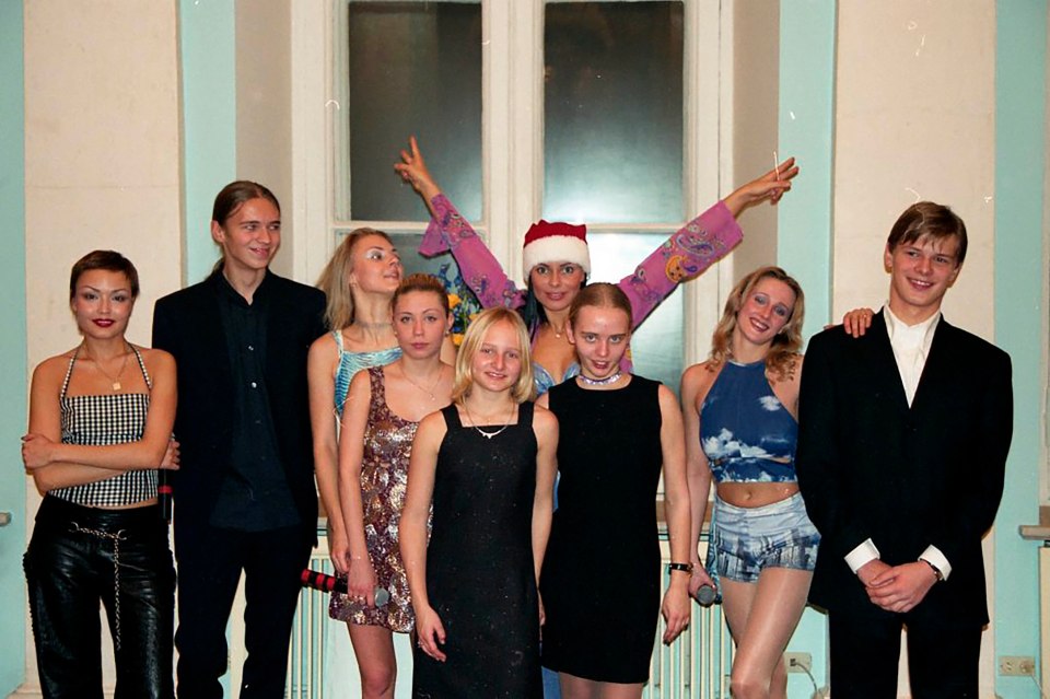 Maria, Katerina, Viktor, and Alexander with members of pop group Strelki