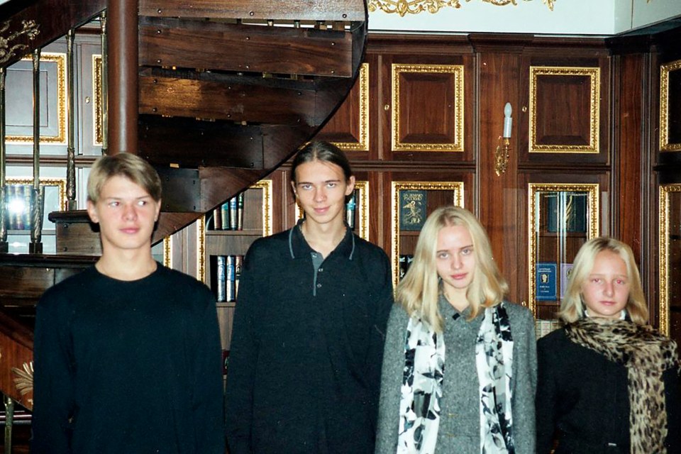 Unseen pictures show Vladimir Putin's daughters, both right, around the time he took power